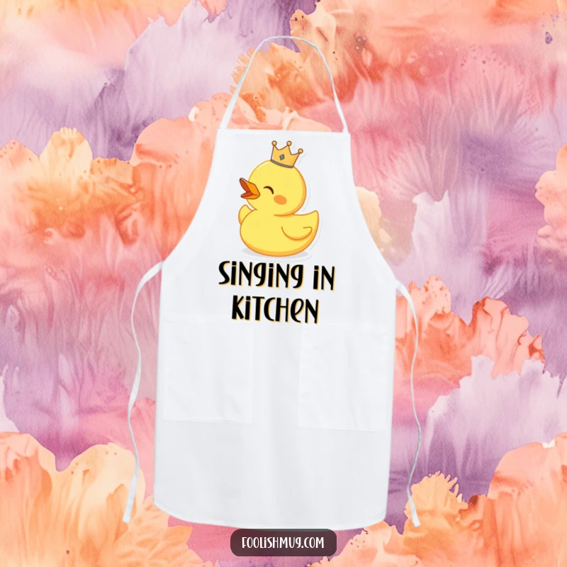 Funny singing rubber duck wearing a tiny crown, on a kitchen apron, for musical cooking.
