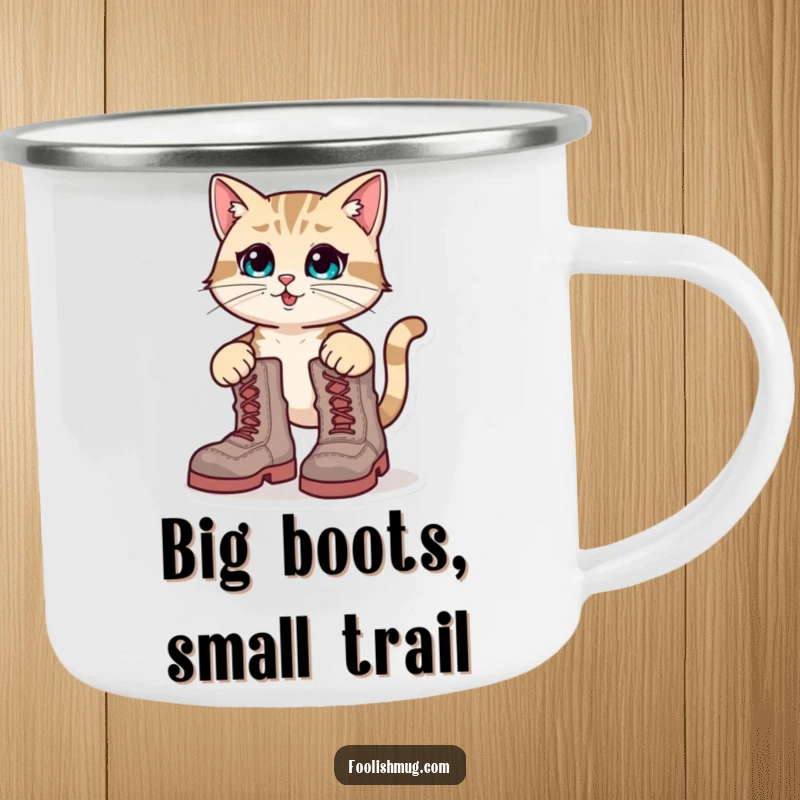 Funny Camping Mug: A determined cat character hilariously attempting to wear oversized boots, perfect for outdoor fun.