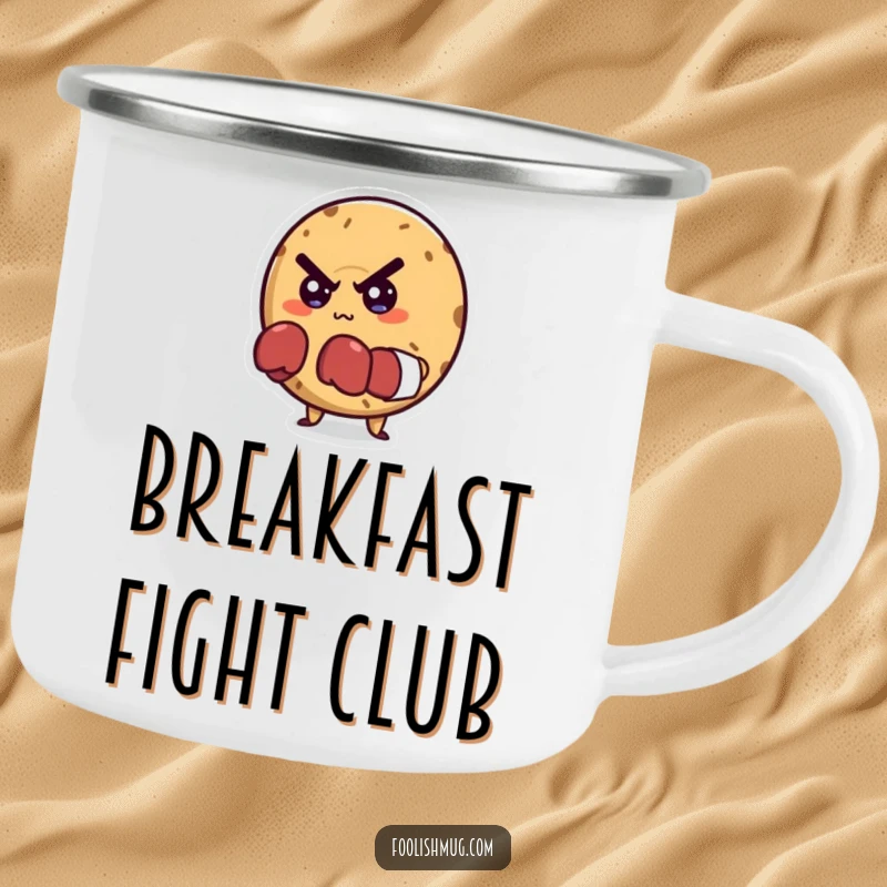Funny camping mug with a mischievous bagel character in tiny boxing gloves, looking determined, ready for outdoor challenges.