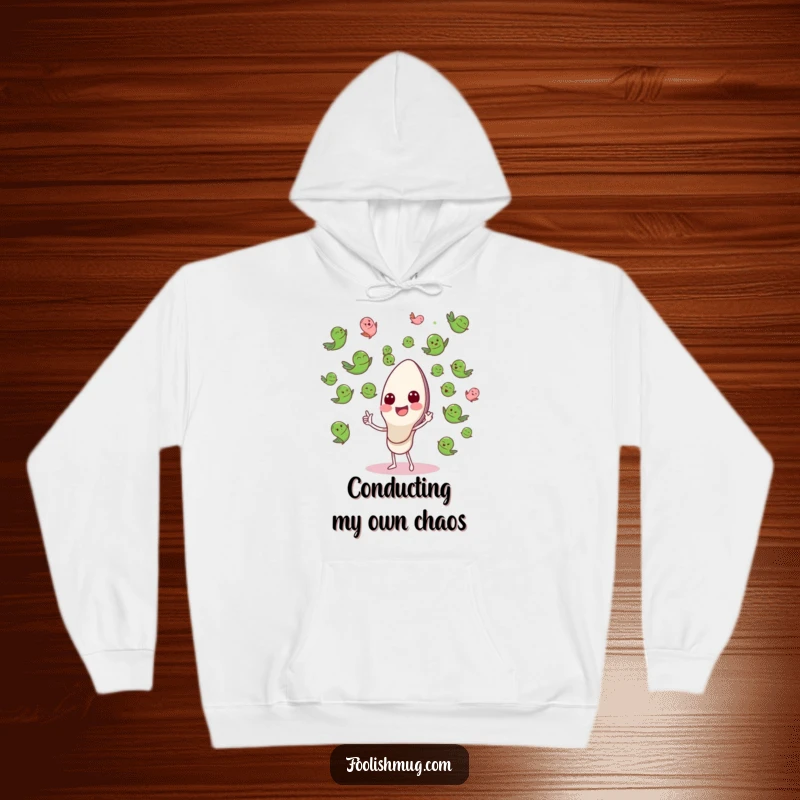Funny Hoodie featuring a happy spoon character conducting a flying pea orchestra, blending comfort with comic artistry.