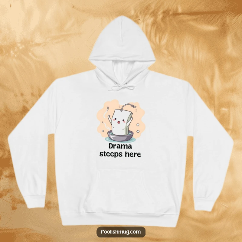 Funny Hoodie: A dramatic teabag character in a theatrical pose, unfurling into hot water. A warming, humorous apparel choice.