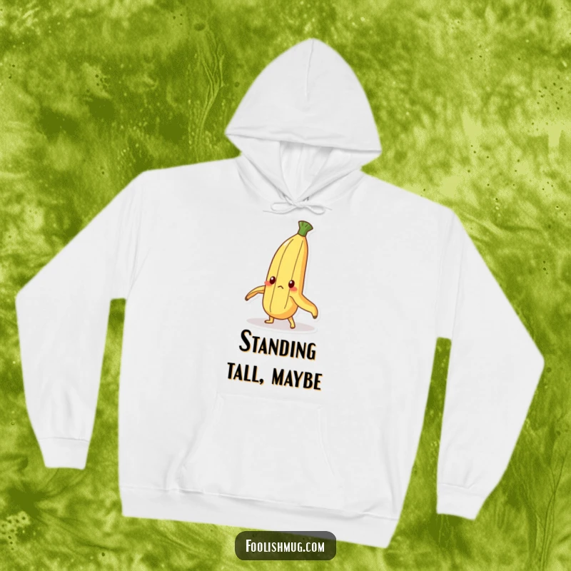 Funny Hoodie: A determined banana peel character striving to stand upright. Cozy apparel with a humorous, resilient message.