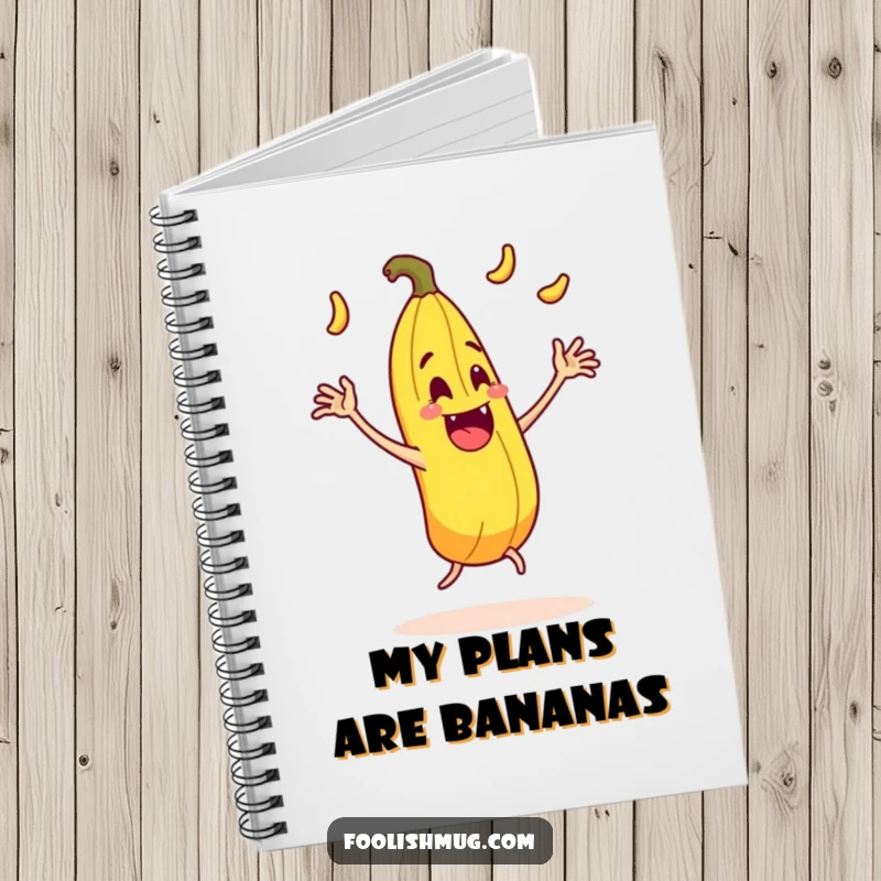 Funny juggling banana peel character comically slipping on itself with exaggerated motion on a notebook, ideal for comedic notes.